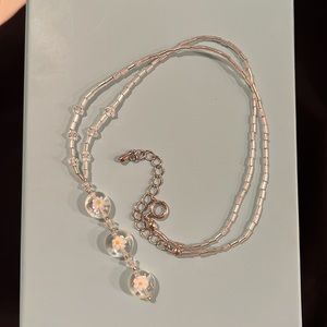 Handmade clear bead necklace with flower beads